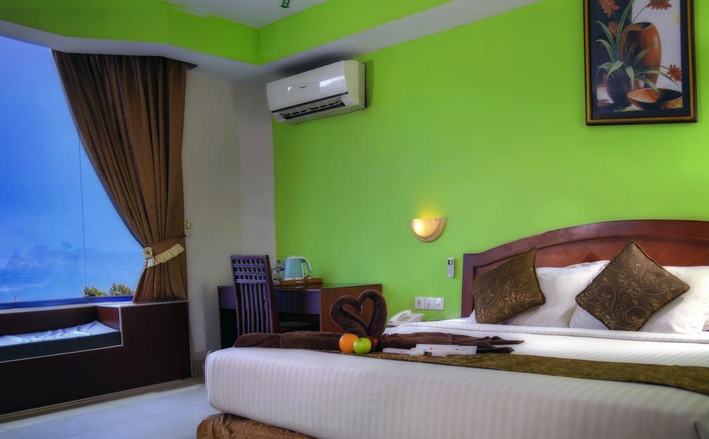 Grand Hotel Jambi Cameră foto